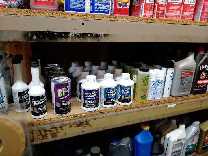 Shelf of oil and fluid products in the shop