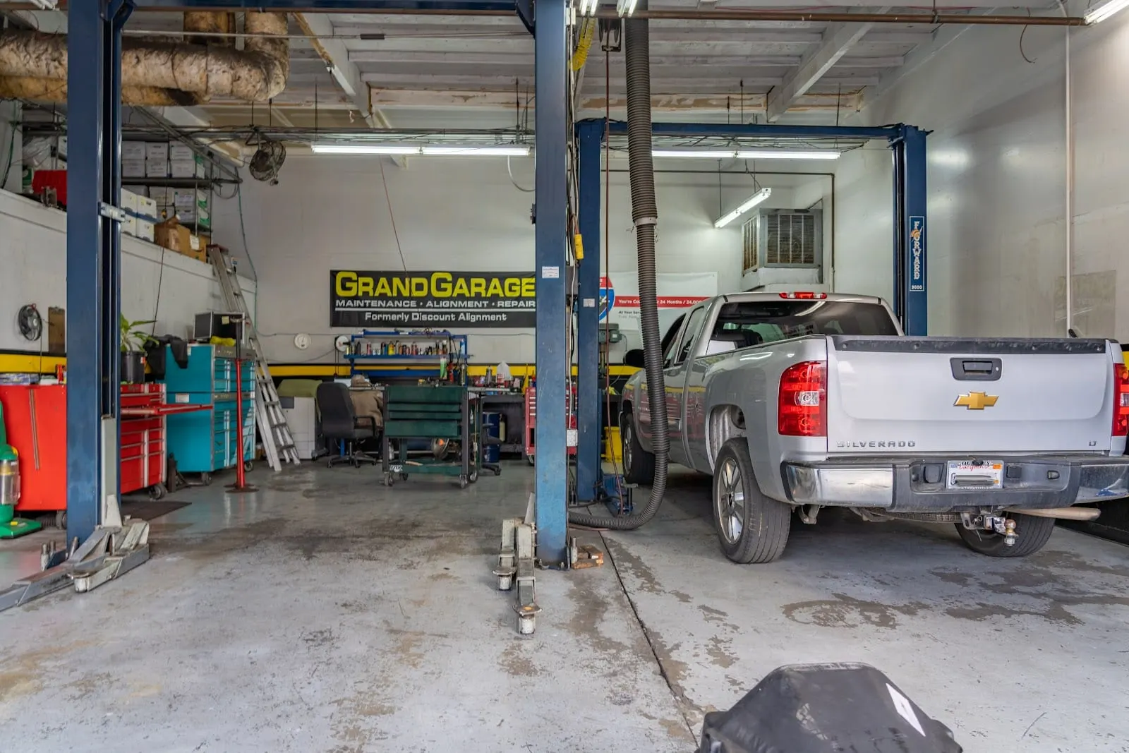 Service bay with a lifted Chevy pickup